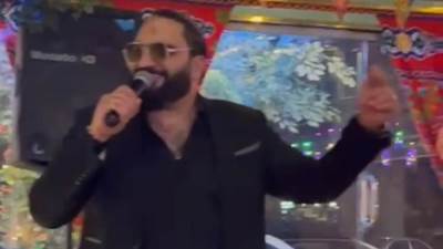 الفنان محمد حسن والموسيقار تامر نصر يشعلون وردة الشيخ زايد